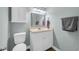 Bathroom features a white vanity, toilet, framed mirror, and cabinet with storage at 178 Salt Marsh Circle # 30D, Pawleys Island, SC 29585