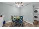 Charming dining area with colorful, hand-painted table set, and a view of the laundry area at 178 Salt Marsh Circle # 30D, Pawleys Island, SC 29585