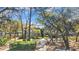 Exterior view of a condo surrounded by trees and greenery in a landscaped community at 178 Salt Marsh Circle # 30D, Pawleys Island, SC 29585