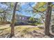 Condo exterior with a green lawn, surrounded by mature trees in a peaceful community at 178 Salt Marsh Circle # 30D, Pawleys Island, SC 29585