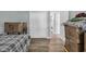 Hallway with hardwood floors, white doors and trim, and visible laundry room in view at 178 Salt Marsh Circle # 30D, Pawleys Island, SC 29585