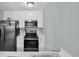 Modern kitchen with stainless steel appliances, white cabinets, and marble countertops at 178 Salt Marsh Circle # 30D, Pawleys Island, SC 29585