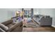 Bright and airy living room with a comfortable sofa and sliding glass doors to a lush outdoor area at 178 Salt Marsh Circle # 30D, Pawleys Island, SC 29585