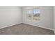 This carpeted bedroom features a window providing natural light at 2191 Gooseberry Way, Longs, SC 29568