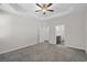 A view of the bedroom that features a ceiling fan, carpet, and two entry doors at 2191 Gooseberry Way, Longs, SC 29568