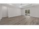 Bright living room with access to the patio and neutral color palette at 2191 Gooseberry Way, Longs, SC 29568
