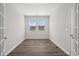 Brightly lit office space with hard wood floors, white trim and french doors at 2191 Gooseberry Way, Longs, SC 29568