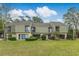 Exterior shot of home featuring a large grassy area in the backyard, perfect for outdoor activities at 25 Gate 1 # 25, Carolina Shores, NC 28467
