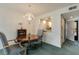 Dining room with table, chairs, and a pass-through to the kitchen at 25 Gate 1 # 25, Carolina Shores, NC 28467