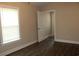 Bright bedroom with hardwood floors, natural light, and an open doorway at 2519 Southern Crest Dr., Loris, SC 29569