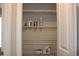 Walk-in closet with white shelving and storage for a variety of household items and personal belongings at 2519 Southern Crest Dr., Loris, SC 29569