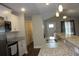Modern kitchen featuring granite countertops, stainless steel appliances, and white cabinetry at 2519 Southern Crest Dr., Loris, SC 29569