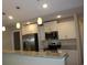 Modern kitchen with stainless steel appliances, granite countertops, and stylish pendant lighting at 2519 Southern Crest Dr., Loris, SC 29569