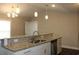 Modern kitchen with stainless steel appliances, granite countertops, and an island with a sink at 2519 Southern Crest Dr., Loris, SC 29569
