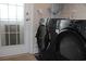 Laundry room with side-by-side washer and dryer next to exterior door at 2519 Southern Crest Dr., Loris, SC 29569