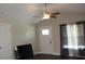 Cozy living room with hardwood floors and a vaulted ceiling with a stylish ceiling fan at 2519 Southern Crest Dr., Loris, SC 29569