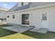 Backyard featuring a concrete patio area, white vinyl siding, and a sliding glass door at 2633 Corn Pile Rd., Myrtle Beach, SC 29588