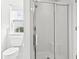 Bright bathroom featuring a tiled floor and a glass shower with a convenient built-in bench at 2633 Corn Pile Rd., Myrtle Beach, SC 29588