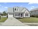 Charming home showcasing a well-manicured lawn, attached garage, and lovely curb appeal at 2633 Corn Pile Rd., Myrtle Beach, SC 29588