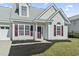 Charming home featuring light siding, an attached garage, and attractive landscaping at 2633 Corn Pile Rd., Myrtle Beach, SC 29588