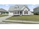 Charming home featuring an attached garage, a well-manicured lawn, and beautiful curb appeal at 2633 Corn Pile Rd., Myrtle Beach, SC 29588