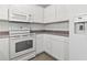 Bright, modern kitchen featuring white cabinets, ample counter space, and appliances at 2633 Corn Pile Rd., Myrtle Beach, SC 29588
