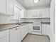 Functional kitchen featuring white cabinetry, a dishwasher, and modern appliances at 2633 Corn Pile Rd., Myrtle Beach, SC 29588