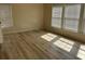Sunlit bedroom with light hardwood floors and large windows at 301 Byrnes Circle, Johnsonville, SC 29555
