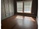 Inviting bedroom featuring modern wall accents and natural light from the windows at 301 Byrnes Circle, Johnsonville, SC 29555