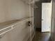 Walk-in closet with shelving and a white door at 301 Byrnes Circle, Johnsonville, SC 29555