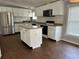 Modern kitchen with white cabinets, stainless steel appliances, and center island at 301 Byrnes Circle, Johnsonville, SC 29555