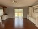 Open-concept room with sliding glass door and custom built-ins at 301 Byrnes Circle, Johnsonville, SC 29555
