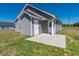 Back of house showing the patio and the grey vinyl siding at 3016 Wise Rd., Conway, SC 29526
