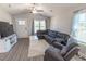 Comfortable living room featuring a gray sectional couch, vaulted ceiling, and natural light at 3016 Wise Rd., Conway, SC 29526