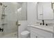 Bright bathroom featuring a glass-enclosed shower, white cabinets, and marble countertops at 311 73Rd Ave. N, Myrtle Beach, SC 29572