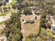 Aerial view of house with landscaping, golf course, and trees at 313 Blue Ridge Dr., Pawleys Island, SC 29585