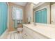 Neutral bathroom featuring a vanity, toilet, and shower with light blue curtain at 313 Blue Ridge Dr., Pawleys Island, SC 29585
