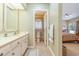 Well-lit full bathroom with neutral colors is conveniently located near the main bedroom at 313 Blue Ridge Dr., Pawleys Island, SC 29585