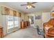 Bedroom with ceiling fan, window, and closet mirror at 313 Blue Ridge Dr., Pawleys Island, SC 29585