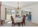 Charming dining area with a decorative chandelier, and large window, bathed in natural light at 313 Blue Ridge Dr., Pawleys Island, SC 29585