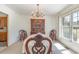 An elegant dining room with a classic chandelier, beautiful wooden furniture, and lots of natural light at 313 Blue Ridge Dr., Pawleys Island, SC 29585
