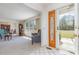 Welcoming foyer area with an elegant glass door and a view into the spacious living room at 313 Blue Ridge Dr., Pawleys Island, SC 29585