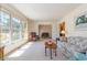 A sun-drenched living room features a comfortable seating area with large windows and ample natural light at 313 Blue Ridge Dr., Pawleys Island, SC 29585