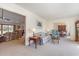 A bright living room with carpet flooring that connects to other areas of the home for seamless entertaining at 313 Blue Ridge Dr., Pawleys Island, SC 29585