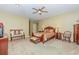 Well-lit main bedroom with carpet, ceiling fan, and ample space for a king-sized bed at 313 Blue Ridge Dr., Pawleys Island, SC 29585
