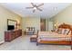 This spacious primary bedroom is equipped with plush carpeting and a ceiling fan at 313 Blue Ridge Dr., Pawleys Island, SC 29585