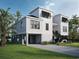 Picturesque coastal home featuring black window shutters, raised foundation and lush tropical landscaping at 318 15Th Ave. S, Surfside Beach, SC 29575