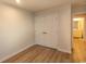 Bright bedroom showing the closet and attached bathroom. The flooring is light wood-look laminate at 341 Golan Circle # B, Myrtle Beach, SC 29579