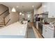 Modern kitchen featuring an island with a sink, stainless steel appliances, white cabinets, and open floor plan at 341 Golan Circle # B, Myrtle Beach, SC 29579