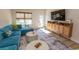 Open concept living room with large television, storage, and comfortable sectional sofa at 341 Golan Circle # B, Myrtle Beach, SC 29579